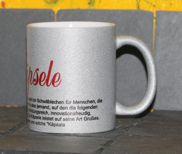 Weiße Tasse mit Spruch "ONSER KÄPSELE"